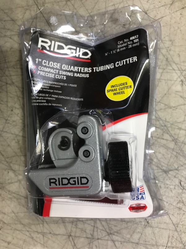 Photo 1 of RIDGID 40617 Model 101 Close Quarters Tubing Cutter with 1/4"-1-1/8" Cutting Capacity, Silver & Rapid Repair RP77271 1/8 Inch to 1-5/8 Inch Outside Diameter Pipe and Tubing Reamer, Red (Single Pack) Cutter + Reamer