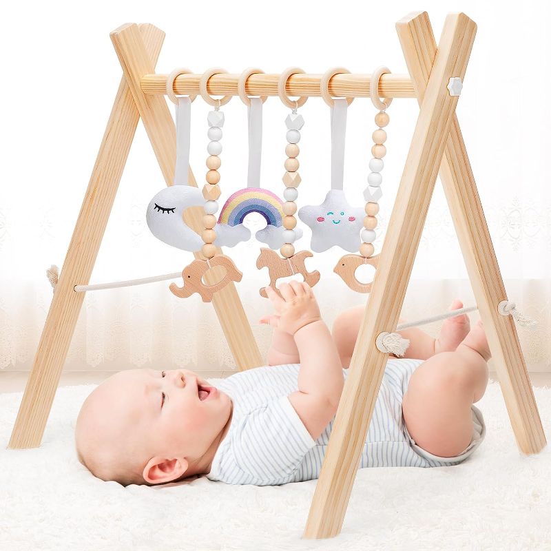 Photo 1 of KIZZYEA Wooden Baby Play Gym, Infant Activity Gym for 0-3-6-12 Months, Wooden Foldable Frame Bar, Baby Activity Center, Newborn Montessori Gift for Boys Girls Ages 0 Month+
