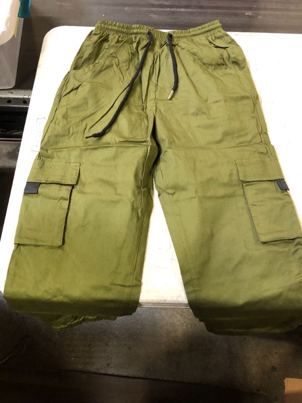 Photo 1 of BOYS CARGO PANTS GREEN 9-12 YR OLD