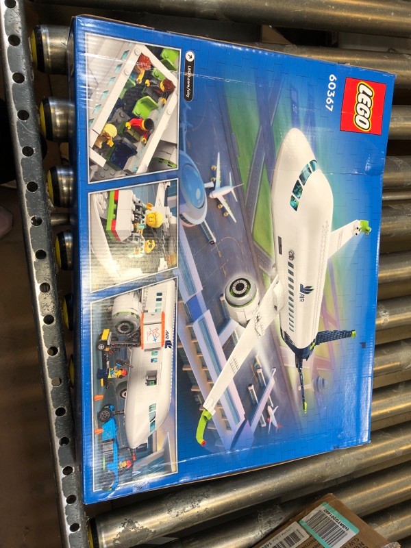 Photo 1 of LEGO City Passenger Airplane 60367 Building Toy Set; Fun Airplane STEM Toy for Kids with a Large Airplane, Passenger Bus, Luggage Truck, Container Loader, and 9 Minifigures