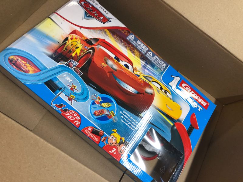 Photo 3 of Carrera First Disney/Pixar Cars - Slot Car Race Track - Includes 2 Cars: Lightning McQueen and Dinoco Cruz - Battery-Powered Beginner Racing Set for Kids Ages 3 Years and Up Disney Cars w/ Spinners