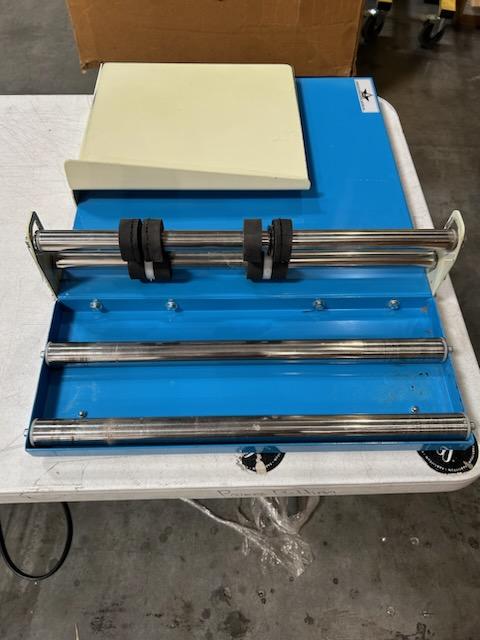 Photo 9 of Deluxe L-Bar Sealer is extremely fast using 1000W power to cut sealing time in half, sealing 6-8 packages per minute. The Deluxe L-Bar Sealer seals and trims up to two 18" sides at once.
Includes 18" film dispenser, film separator, worktable and twin perf