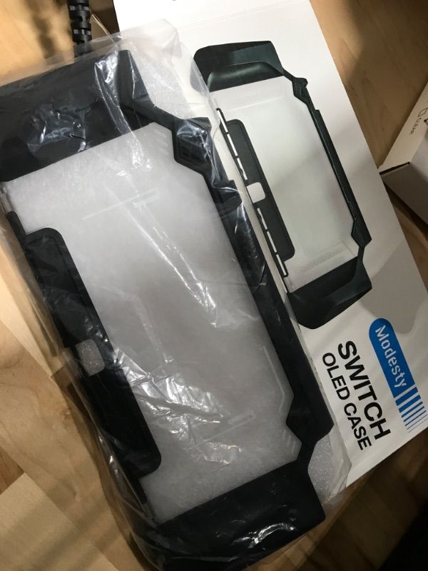 Photo 2 of MODESTY Dockable Case Compatible with Nintendo Switch OLED 2021, [Lightweight Series ] Upgraded Protective Dockable Cover, Ergonomic Comfort TPU Grip Case for Nintendo Switch OLED Console and Joy-Con