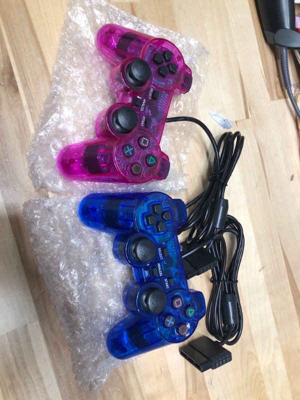 Photo 1 of Lot Of 2 Wired Gaming Controllers For PS2 PS1 Clear Purple And Clear Blue
