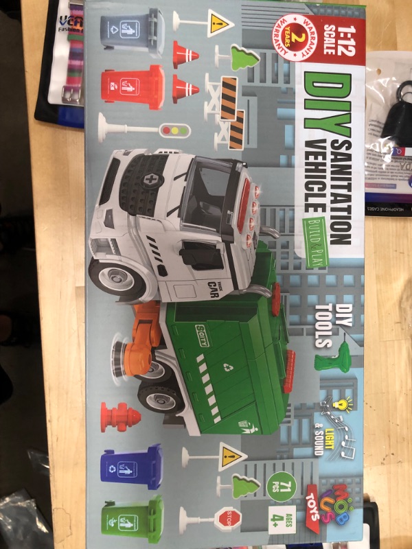 Photo 2 of 
71 PCS Take Apart Garbage Truck Playset – 1:12 SCALE Push & Go + Electric Drill, Sounds & Lights, Road Signs Set, 4 TRASH CANS & 40 FLASH CARDS...
Color:Garbage Truck - 71 Pcs