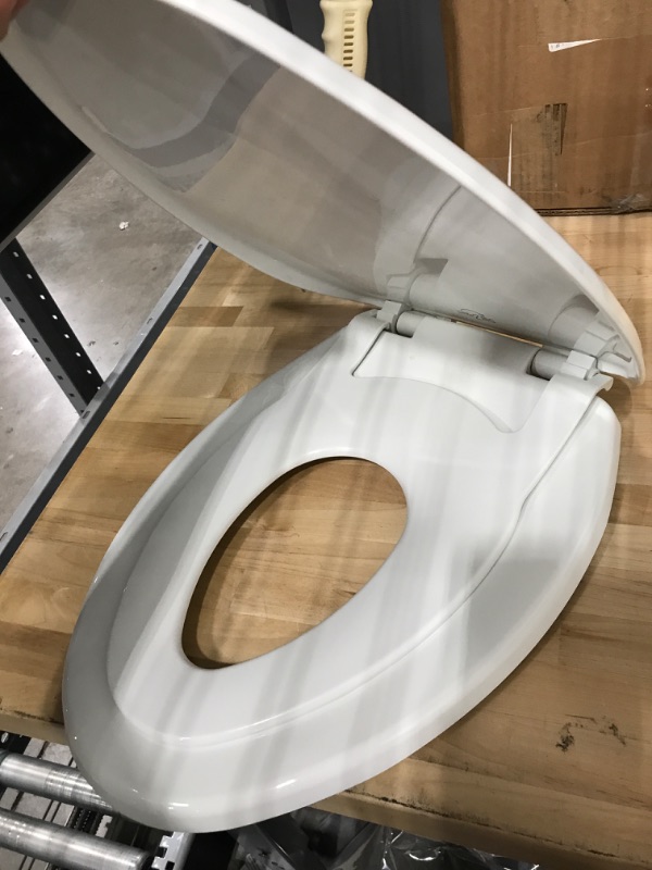 Photo 3 of **USED**
Little2Big 181SLOW 000 Toilet Seat with Built-In Potty Training Seat, Slow-Close, and will Never Loosen, ELONGATED, White 1 Pack Elongated