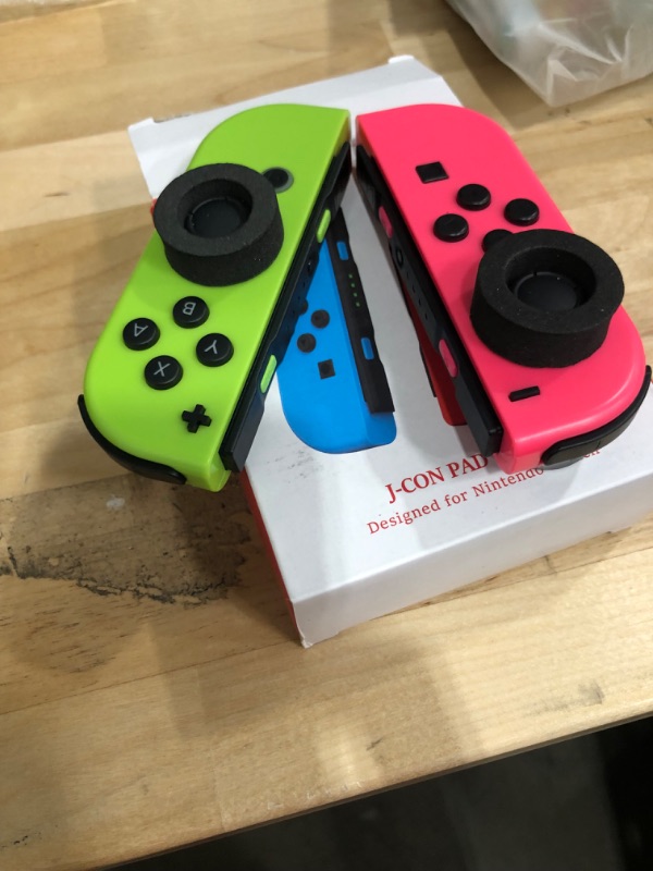 Photo 1 of Nintendo Switch Joy-Con Controller Pair - Neon Red/Neon Blue
