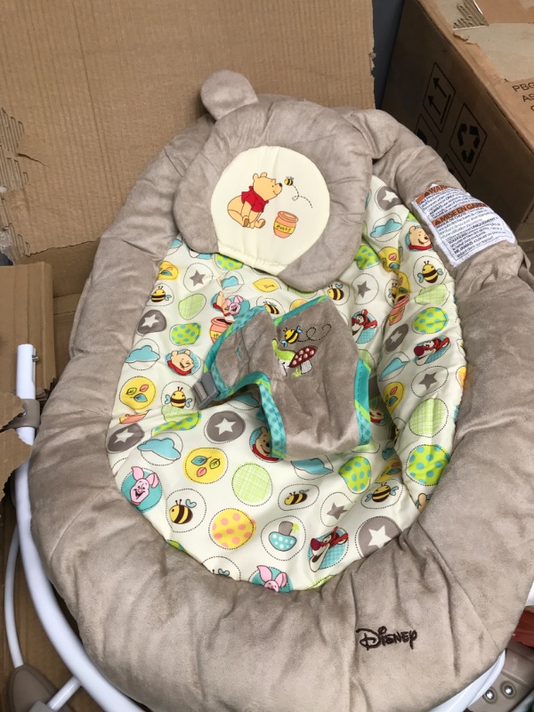 Photo 2 of Bright Starts Winnie the Pooh Dots & Hunny Pots Baby Bouncer with Vibrating Infant Seat, Music & 3 Playtime Toys, 23x19x23 Inch
