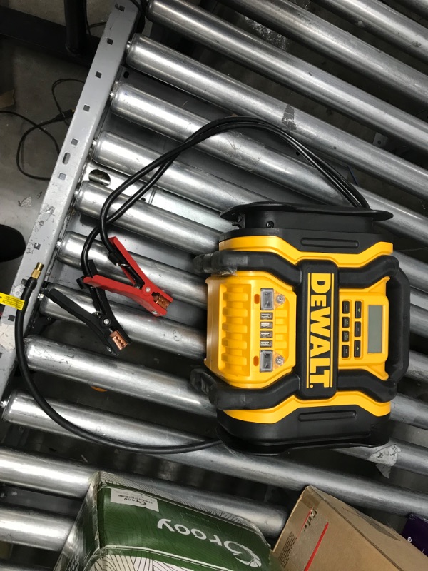 Photo 1 of DEWALT DXAEPS14 1600 Peak Battery Amp 12V Automotive Jump Starter/Power Station with 500 Watt AC Power Inverter, 120 PSI Digital Compressor, and USB Power , Yellow