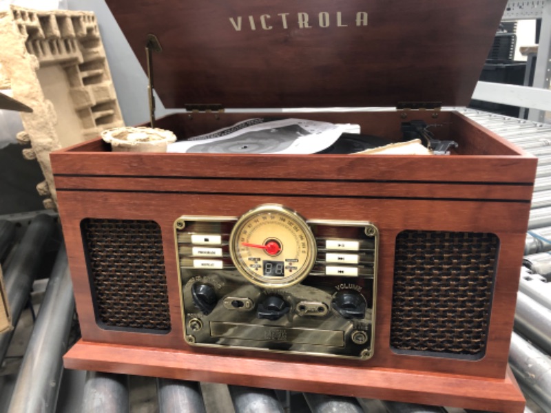 Photo 3 of *NON FUNCTIONAL* 
Victrola Nostalgic 6-in-1 Bluetooth Record Player & Multimedia Center with Built-in Speakers - 3-Speed Turntable, CD & Cassette Player, FM Radio | Wireless Music Streaming | Mahogany Mahogany Entertainment Center