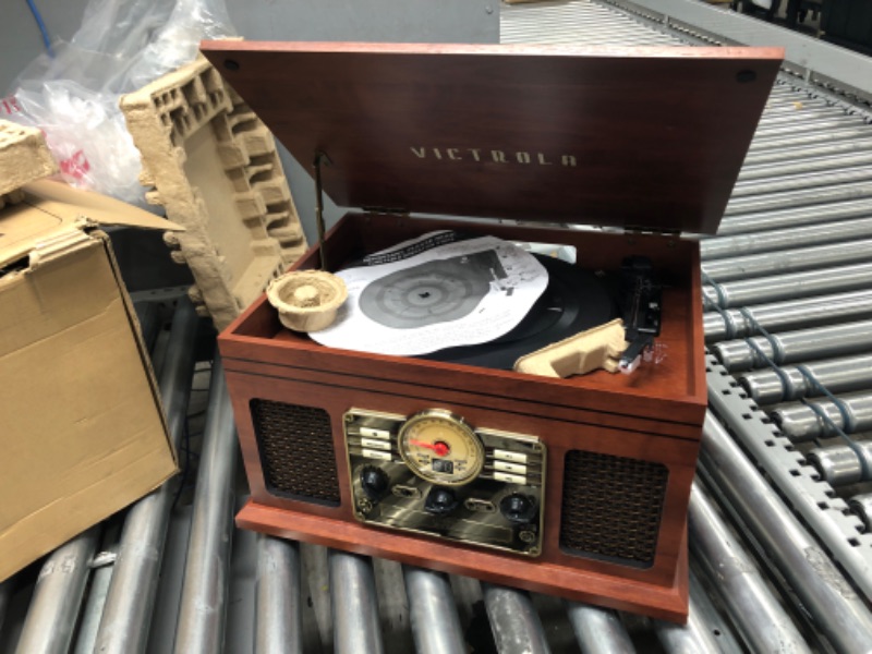 Photo 2 of *NON FUNCTIONAL* 
Victrola Nostalgic 6-in-1 Bluetooth Record Player & Multimedia Center with Built-in Speakers - 3-Speed Turntable, CD & Cassette Player, FM Radio | Wireless Music Streaming | Mahogany Mahogany Entertainment Center