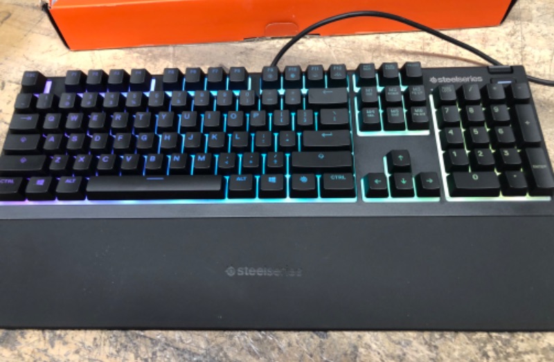 Photo 2 of SteelSeries Apex 3 RGB Gaming Keyboard – 10-Zone RGB Illumination – IP32 Water Resistant – Premium Magnetic Wrist Rest (Whisper Quiet Gaming Switch)