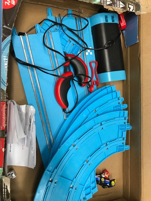 Photo 1 of Carrera First Nintendo Mario Kart Slot Car Race Track - Includes 2 Cars: Mario and Luigi and Two-Controllers - Battery-Powered Beginner Set for Kids Ages 3 Years and Up, 20063028 Mario Kart / Flippers