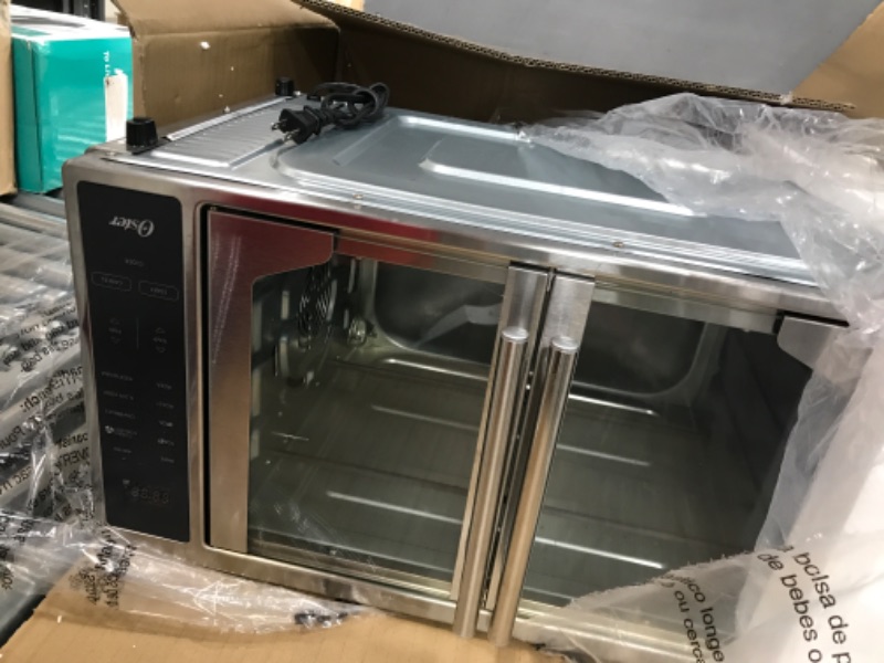 Photo 4 of ***PARTS ONLY NOT FUNCTIONAL***
Oster Air Fryer Oven, 10-in-1 Countertop Toaster Oven, XL Fits 2 16" Pizzas, Stainless Steel French Doors
