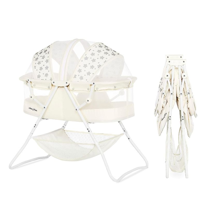 Photo 1 of Dream On Me Karley Bassinet in French White, Lightweight Portable Baby Bassinet, Quick Fold and Easy to Carry , Adjustable Double Canopy, Indoor and Outdoor Bassinet with Large Storage Basket.
