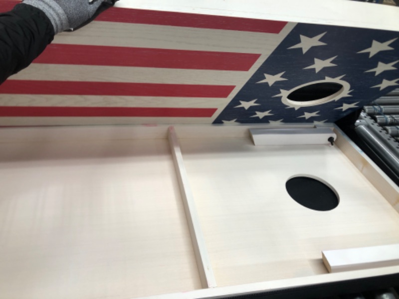 Photo 3 of **see images for damage**
Flag Series Wood Cornhole Set – Includes Two Regulation Size 4 ft x 2 ft Boards, 8 Bean Bags, Carrying Case and Rules
