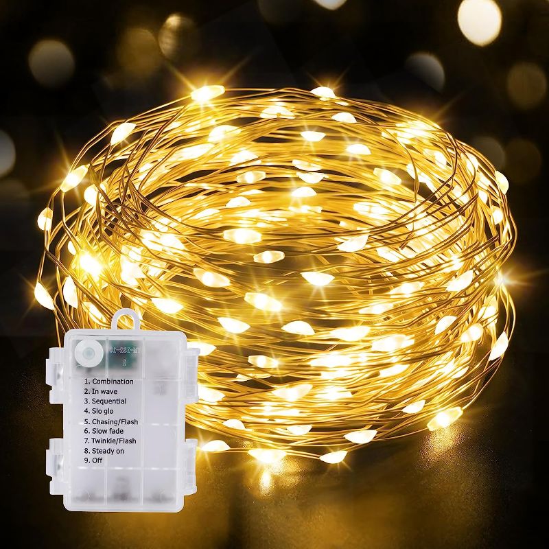 Photo 2 of *NOT TESTED*  KNONEW Led Fairy Lights Battery Operated, 16.4FT 50 LED Copper Wire Led String Lights, 8 Modes Waterproof Fairy Lights for Wedding, Wedding Bedroom Centerpiece Indoor Outdoor Decorations (Multicolor)
