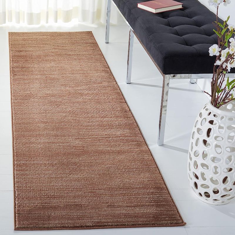 Photo 1 of 26IN. X 70IN BROWN AREA RUG(UNKNOWN BRAND)