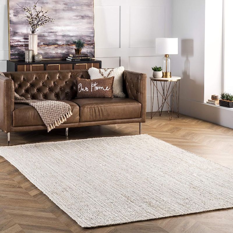 Photo 1 of 2' X 10' LIGHT BROWN AREA RUG(UNKNOWN BRAND)