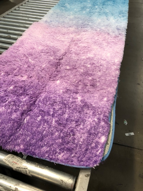 Photo 1 of 5' X 7' MULTICOLORED PLUSH AREA RUG(UNKNOWN BRAND)