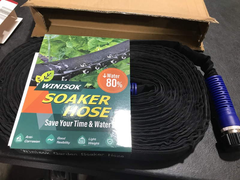 Photo 2 of [Upgraded] Winisok 50FT Thickened Flat Garden Soaker Hose - Heavy Duty Double Layer Drip Hose - Save 80% Water, Flexible Leakproof, Kink Free Watering Hose for Garden Beds and Lawns