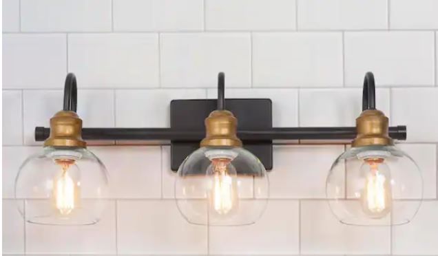 Photo 1 of 22 in. 3-Light Modern Aged Brass and Black Bathroom Vanity Light with Clear Glass Globe Shades

