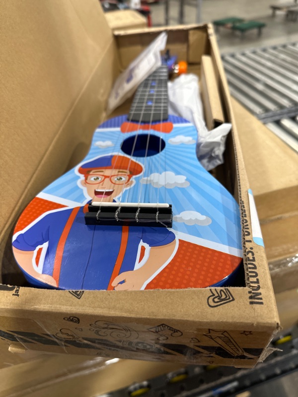 Photo 2 of Blippi Ukulele by First Act, Featuring YouTube Educational Entertainer Ukulele for Beginners, Musical Instruments & Costume Roleplay Accessories, Perfect for Dress Up and Play Time Ukulele + Accessories