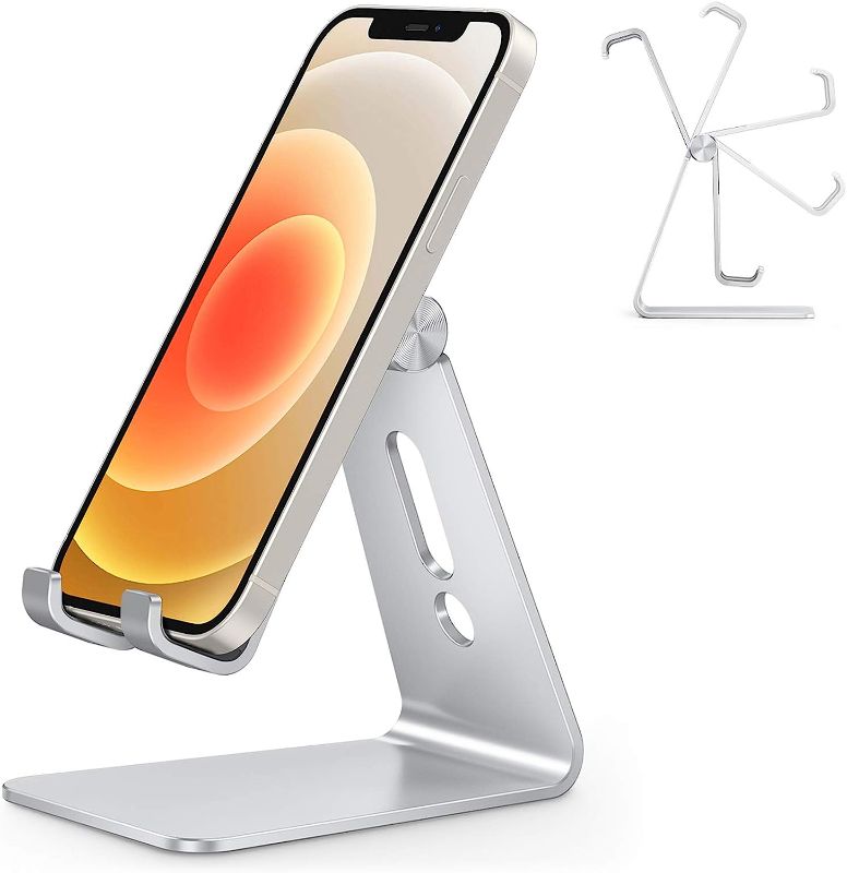 Photo 1 of Adjustable Cell Phone Stand, OMOTON Aluminum Desktop Cellphone Stand with Anti-Slip Base and Convenient Charging Port, Fits All Smart Phones, Silver
