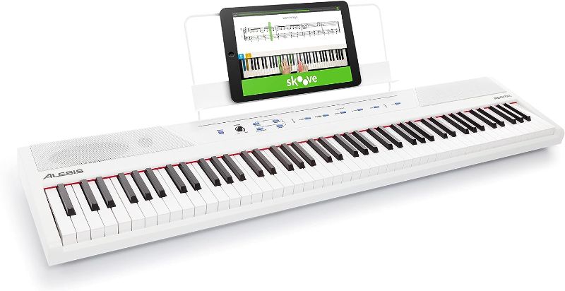 Photo 1 of Alesis Recital – 88 Key Digital Piano Keyboard with Semi Weighted Keys, 2x20W Speakers, 5 Voices, Split, Layer and Lesson Mode, FX and Piano Lessons
