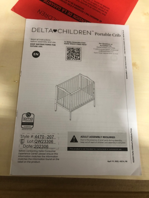 Photo 3 of Delta Children Portable Folding Crib with Mattress, Brown, INFANT
