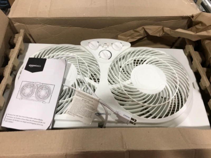 Photo 1 of Amazon Basics Window Fan with Manual Controls, Twin 9 Inch Blades, White

