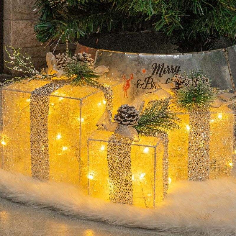 Photo 1 of Hourleey Set of 3 Christmas Lighted Gift Boxes, Pre-lit 60 LED Light Up Present Boxes Ornament Outdoor Warm White Tinsel Boxes Decoration for Indoor Christmas Home Yard Lawn Decor
