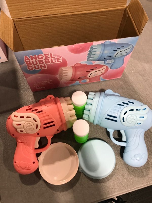 Photo 2 of 2 Bubble Guns for Kids, 23 Hole Bazooka Bubble Machine Gun with Bubbles Solution for Children Ages 3 4 5 6 7 8 Party Favors Birthday Blue&pink