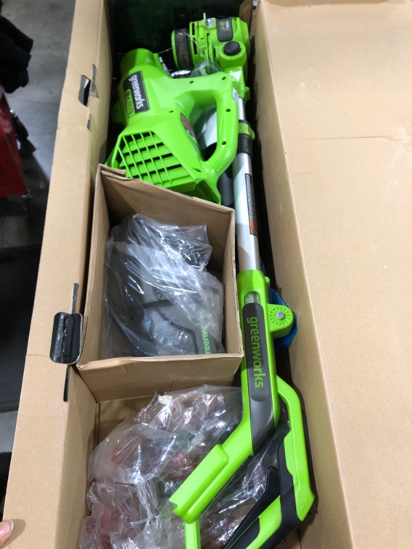 Photo 1 of Greenworks 24V 12-Inch Cordless String Trimmer/Edger and Leaf Blower Combo Kit + 3 Bonus Spools, 2.0Ah Battery and Charger Included NEW 12" Trimmer + Blower + Spools (2.0Ah)