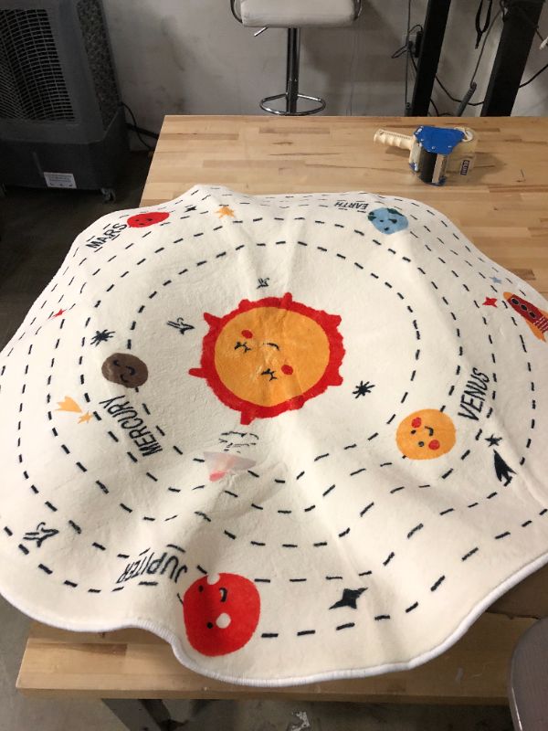 Photo 1 of ATHNG Solar System Carpet,63" Cartoon Fluffy Circle Rug,Round Rugs for Girls Bedroom,Circle Area Rugs for Boys,Cute Room Decor for Kids 40 inch Beige 1