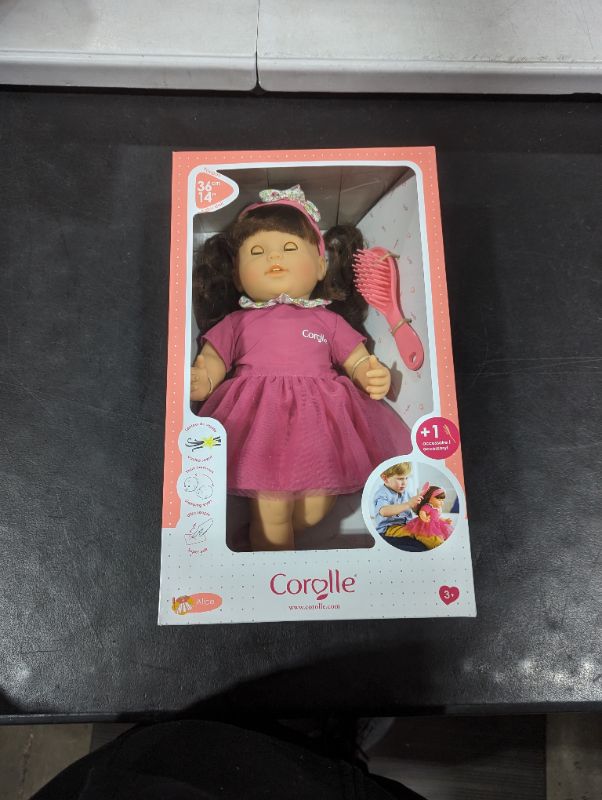 Photo 1 of Alice is a 14-inch; soft-bodied mon grand poupon Corolle baby doll for little ones wanting a baby of their own to love. With her long easy-to-style hair; children are introduced to hairstyling play (hairbrush included). Alice has brown sleepy eyes that cl
