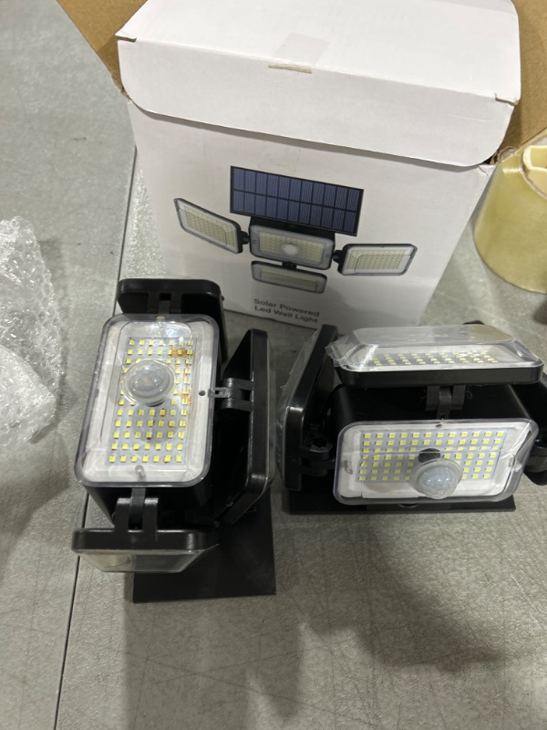 Photo 2 of Mokot Solar Outdoor Lights, 288 LED IP65 Waterproof Motion Sensor Outdoor Lights with Remote Control, 4 Heads Solar Flood Wall Lights for Outside Garden Patio Yard - 2Pack