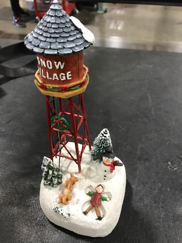 Photo 1 of  Christmas Snow Village Accessories Figurines - Holiday Time Snow Village Kid Playing with Dog Scene Light Up Water Tower Collectible
