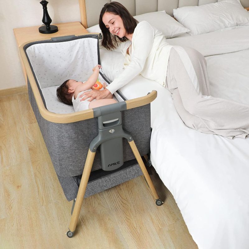 Photo 1 of AMKE 3 in 1 Baby Bassinets,Bedside Sleeper for Baby,Baby Cradle with Storage Basket, Easy to Assemble Bassinet for Newborn/Infant, Adjustable Bedside Crib,Safe Portable Baby Bed,Travel Bag Included Grey - Wood Grain