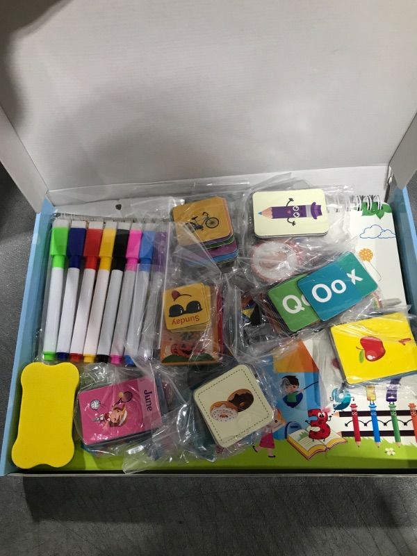 Photo 1 of CALSPY Magnetic Busy Book for Kids, Montessori Preschool Learning Activities for Toddlers 23 Pages Autism Sensory Education Games Toys for Children Birthday Gifts Airplane Travel Christmas Halloween 24 Themes