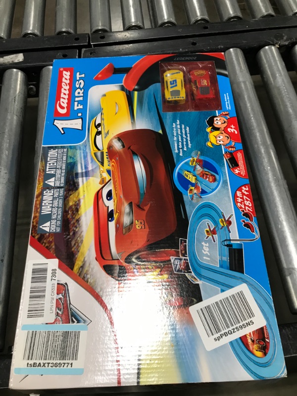 Photo 2 of Carrera First Disney/Pixar Cars - Slot Car Race Track - Includes 2 Cars: Lightning McQueen and Dinoco Cruz - Battery-Powered Beginner Racing Set for Kids Ages 3 Years and Up Disney Cars w/ Spinners