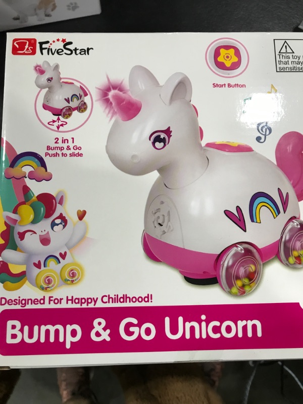 Photo 1 of 2 IN 1 BUMP AND GO UNICORN