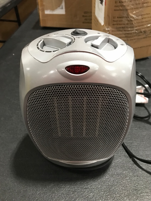 Photo 2 of Amazon Basics 1500W Oscillating Ceramic Heater with Adjustable Thermostat, Silver Silver Heater with Oscillating. PRIOR USE. 