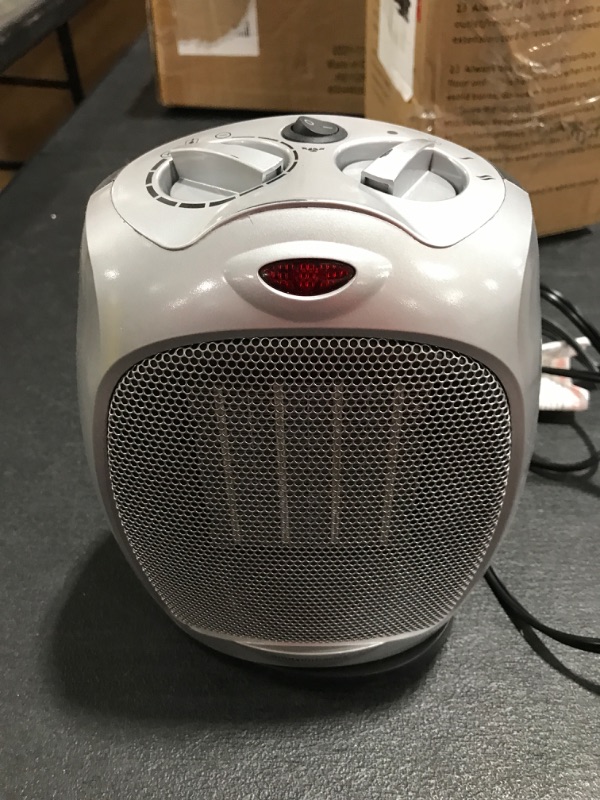 Photo 1 of Amazon Basics 1500W Oscillating Ceramic Heater with Adjustable Thermostat, Silver Silver Heater with Oscillating. PRIOR USE. 