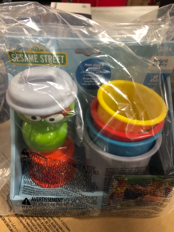 Photo 2 of Bright Starts Sesame Street Oscar the Grouch’s Stacking Cans Stackable Cups, Ages 3-12 months Oscar Stacking Cans