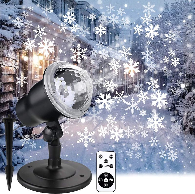 Photo 1 of Christmas Projector Lights Outdoor, Holiday Snow Projector with Wireless Remote Control for Landscape Decorative Snowflake Lighting on Christmas New Year Birthday Party Covering House in Snow Flakes
