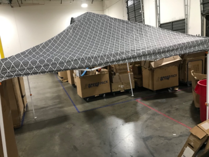 Photo 1 of 10ftx10ft canopy --has minor damage, a small hole on top--does not come with case --sold as is 