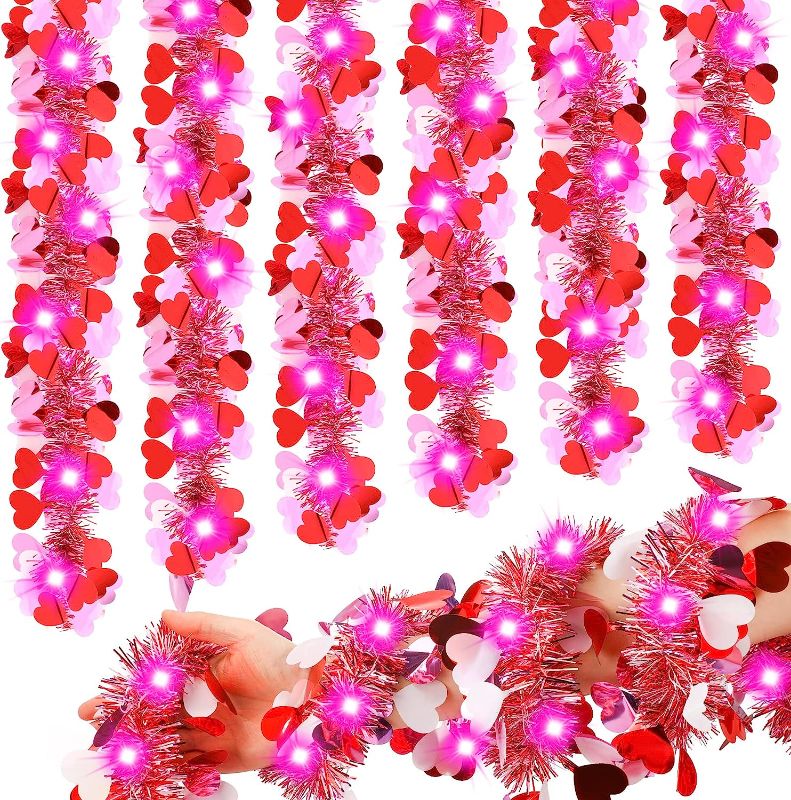 Photo 1 of 16.4 Feet Valentine's Day Tinsel Garland with Lights Metallic Tinsel Twist Garland Hanging Shiny Tinsel Garland with 50 LEDs String Lights for Tree Wreath Wedding Party Decorations (Mixed Pink)
