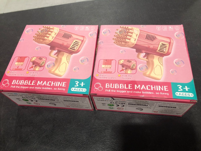 Photo 1 of 2 PACK Small Bubble Gun for Kids - 32 Holes Bazooka Bubble Machine Gun with 2 Bubble Solution Automatic Bubble Maker Blower for Outdoor Play Activity Birthday Party Wedding (Pink) 