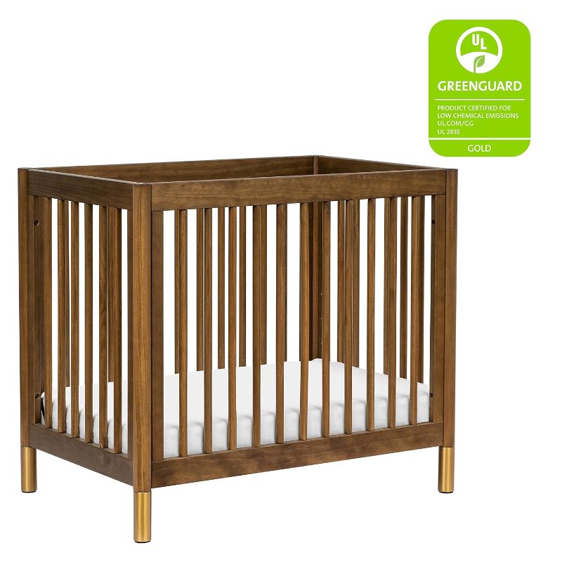 Photo 1 of Babyletto Gelato 4-in-1 Convertible Mini Crib in Natural Walnut and Brushed Gold Feet, Greenguard Gold Certified